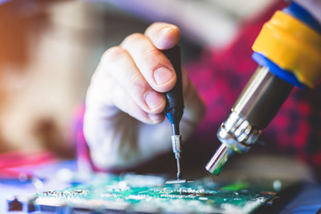 Man fixing PC hardware.