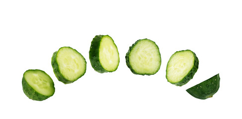 Cucumber cut into slices on a white background