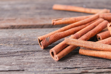 cinnamon sticks on wooden background