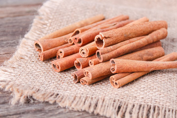 cinnamon sticks on wooden background
