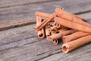 cinnamon sticks on wooden background