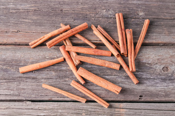 cinnamon sticks on wooden background