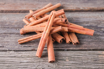 cinnamon sticks on wooden background