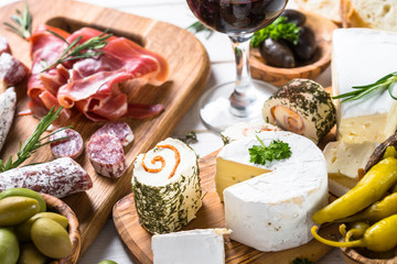Antipasto delicatessen - meat, cheese and wine.