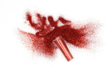 Jar with spilled red  glitter Magical, celestial red glitter spilling out of a jar isolated on...