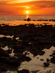 Fototapeta na wymiar Orange sunset on sea