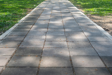Fototapeta premium patterned paving tiles, cement brick floor background