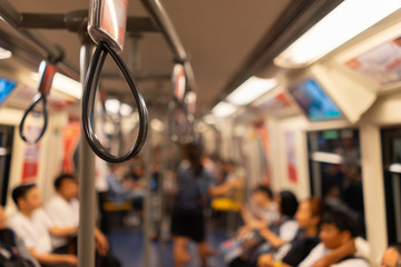 BTS skytrain with office worker in rush hour at Bangkok, Thailand.