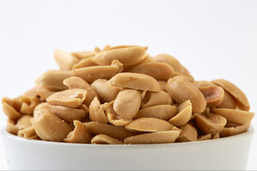 Roasted peanuts and salt in a bowl
