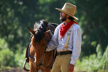 Foto op Canvas cowboy and horse  at first light,mountain, river and lifestyle with natural light background © FotoArtist