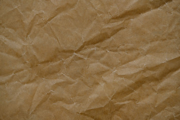Wrinkled brown cardboard sheet paper for design background. Textured paper background