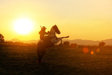 cowboy and horse  at first light,mountain, river and lifestyle with natural sunset light background