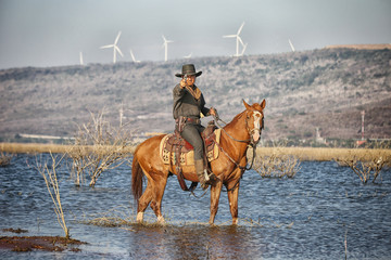 cowboy and horse  at first light,mountain, river and lifestyle with natural light background