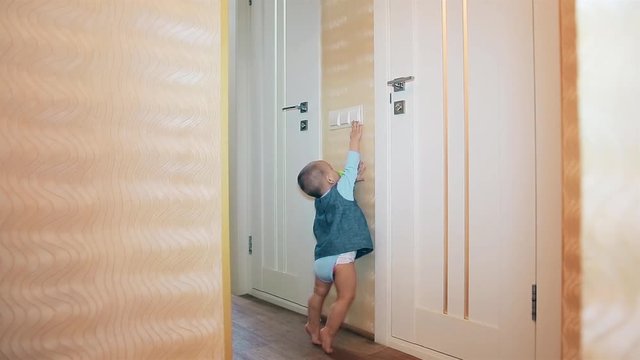 The little baby girl reaches for the light switches HD 1920x1080p