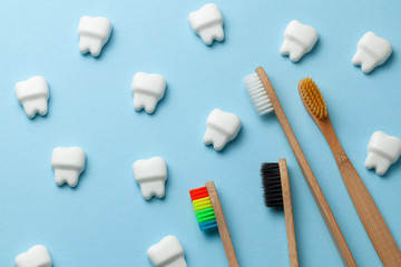 Healthy white teeth on pink background with toothbrush