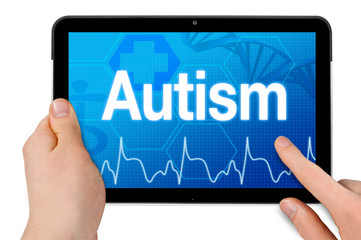 Tablet computer with diagnosis autism isolated on white background
