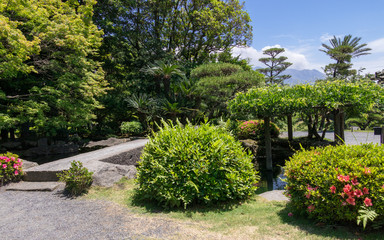 Beautiful Japanese Garden covered by green Landscape. Taken in the wonderful Sengan-en Garden. Located in Kagoshima, Kyushu, South of Japan.