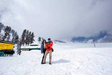 Fototapeta na wymiar man and woman on ski resort
