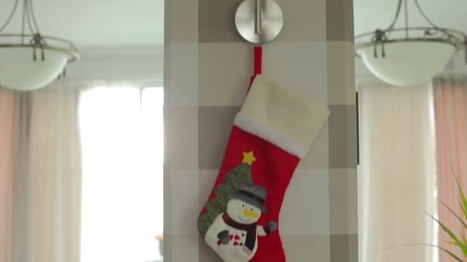 Santa Claus sock hangs on the lamp