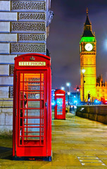 Fototapeta na wymiar View of the Telephone Box and Houses of Parliament in London at night.