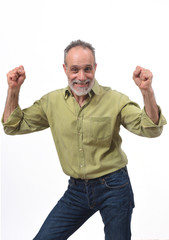 Fototapeta premium man raising her arms and smiling in victory sign on white background