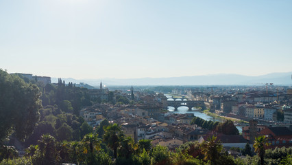 View of Florence, bridges and river, the red roofs of houses.