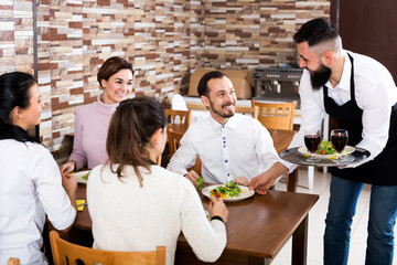 Fototapeta premium Waiter bringing order to visitors