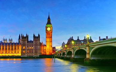Fototapeta na wymiar View of the Houses of Parliament and Westminster Bridge along River Thames in London at night.
