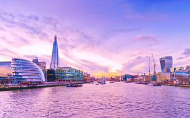 Panorama of London skyline and River Thames at dusk.