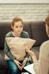 Nice red haired girl having a psychological session