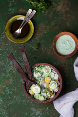 potato salad with egg, radishes and cucumbers