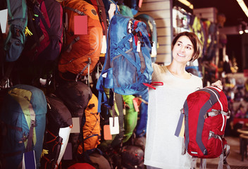 Fototapeta na wymiar Woman choosing new rucksack