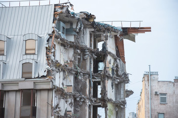 Destroyed building after demolition, man-made accident. Engineering and construction errors.