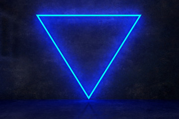 neon triangle on black concrete wall