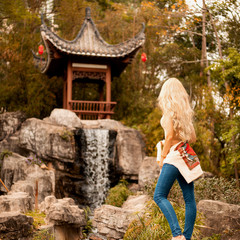 Перевести вGoogleBingthe traveler looks Asian attractions. Chinese waterfall.the traveler looks Asian attractions. Chinese waterfall.