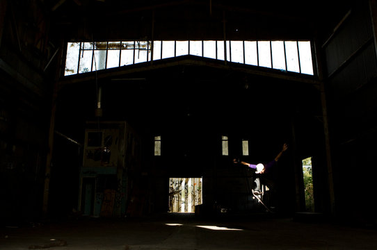 Australian skater Mitch Faber ollies in an abandoned warehouse on the Central Coast, New South Wales, Australia.