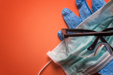Gloves, mask, and safety glasses. Health care and medical background concept.