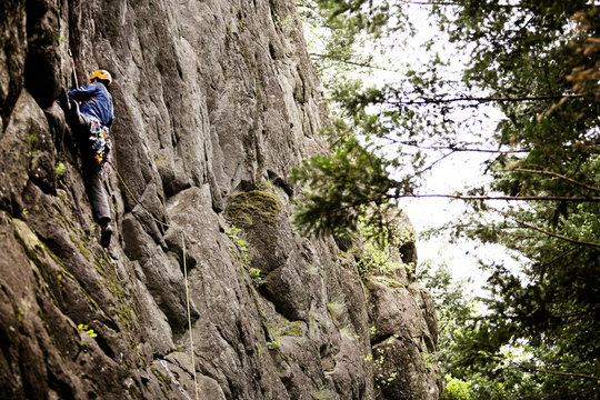 Male climber climbing on the rock