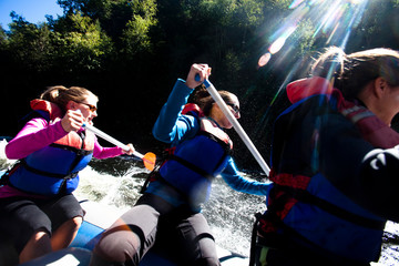 A group of adults navigate the Kennebec River in West Forks, Maine during a whitewater rafting trip on September 11, 2010.  This day water flow was 8,000 cubic feet per second, which is almost twice the normal amount of water flow.