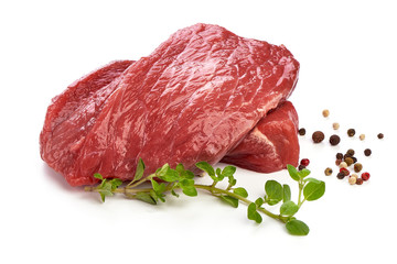 Raw ribeye beef steak with rosemary, sliced fresh meat, close-up, isolated on white background