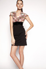 Studio portrait of beauty woman in casual clothes. Young model standing on white background