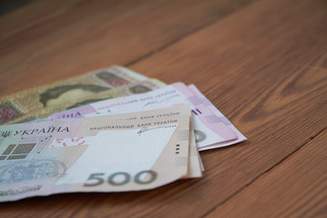 Ukrainian national currency, bills of different values, the calculation between people, the transfer of money.