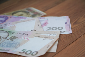 Ukrainian national currency, bills of different values, the calculation between people, the transfer of money.