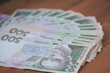 Ukrainian national currency, bills of different values, the calculation between people, the transfer of money.