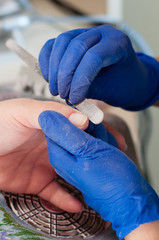 Beautiful female manicure, the process in the spa salon. Beauty services concept