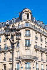Paris, beautiful building in the Marais, typical parisian facade and windows, with a lamppost, rue Saint-Martin