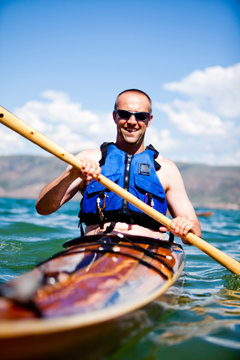 Brian Priebe paddles a wooden kayak, Bear Lake.