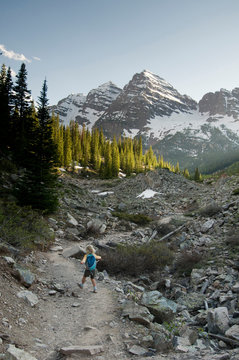 A young girl hiking trail to  Crater Lake, Maroon Bells Wilderness, Aspen, Colorado.