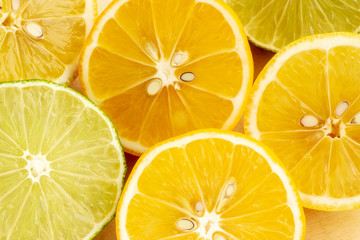 Refreshing citrus background of lemon and lime slices