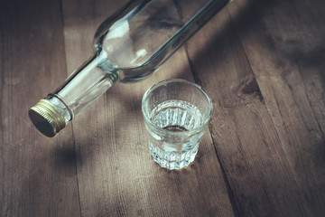 Vodka on a wood background.